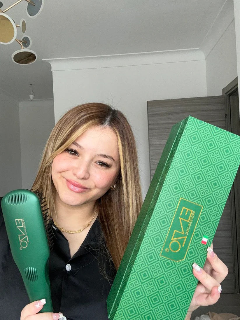 Woman holding a green hair straightener and a green box with a brand logo.